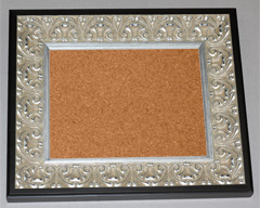 An ornage frame can spruce up a plain cork board