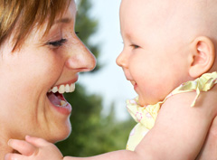 Mom and baby sharing a happy, smiling moment