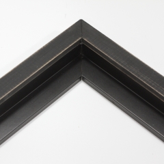 This simple, canvas floater frame features rustic wood lightly coated in charcoal grey/black paint.  The top coat is rubbed away in places to reveal the natural wood color below, for a soft, antiqued look.

3/4 " wide: ideal for small and medium-size images.  Whether photography or paintings, rural scenes and simple images will look striking in this frame.