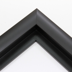 This simple, matte black frame features a thick curved profile.  The slope of the face makes this a simple but glamorous selection. A 1 " rabbet gives this frame a narrow shadow-box quality.

Ideal for medium-sized and large images.  Select an oil or watercolour painting, print, or grayscale photograph.