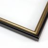 This thin 7/8 " scoop frame features a black exterior with a contrasting gold lip. This sleek traditional frame will add a modern touch of elegance to your artwork.